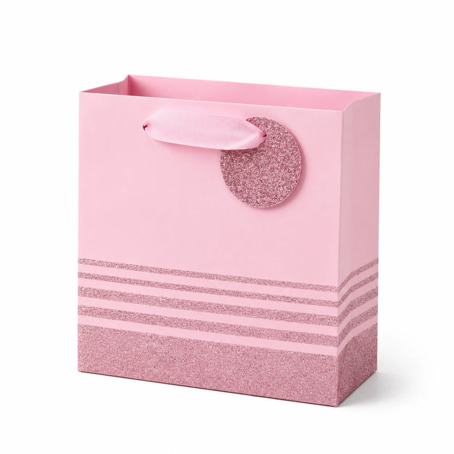 Borsa regalo 25 x 12 x 25 cm in carta rosa con manici a nastro e finitura glitter