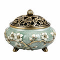 Bruciatore di incenso in ceramica 18 x 15 cm verde chiaro e bronzo con coperchio traforato floreale